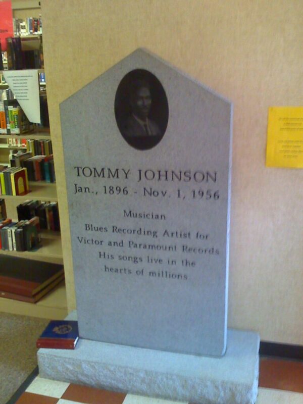 The headstone of Tommy Johnson in 2010 inside the Crystal Springs Public Library