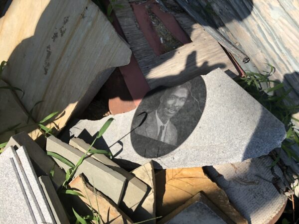 The remains of the headstone outside the workshop of Alan Orlicek in Arcola, MS