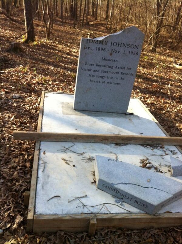 The broken headstone after it had been stood back up
