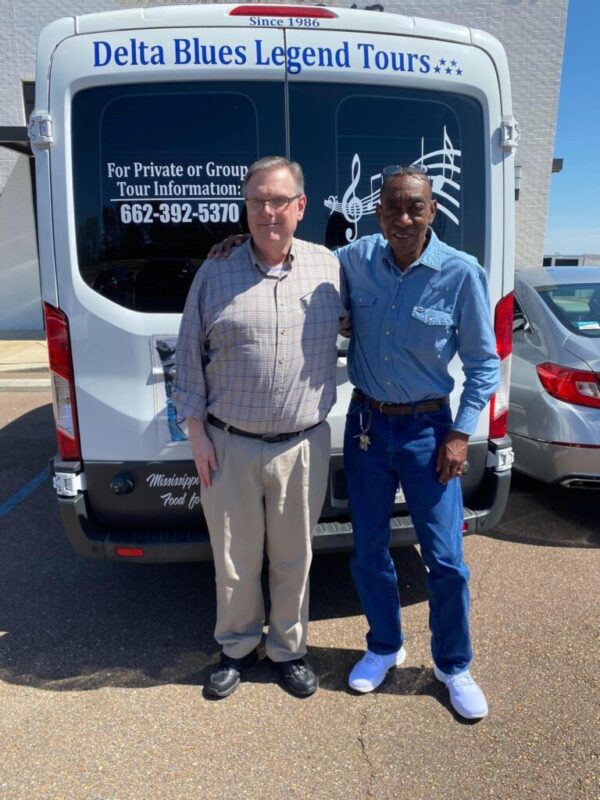 Corey Crowder and Sylvester Hoover beside Sylvester’s touring van (Photo: © Mary Hoover, 2023)